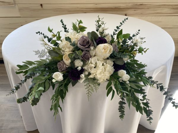 Purple silk floral head table arragement