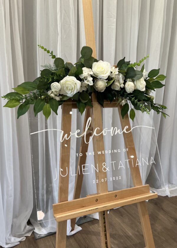 Welcome Sign Clear Plexi Glass, silk floral rentals, veronica easel arrangement