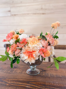orange and coral silk floral arrangement