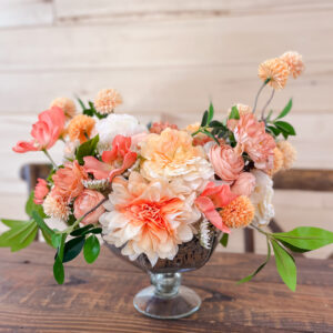 orange and coral silk floral arrangement